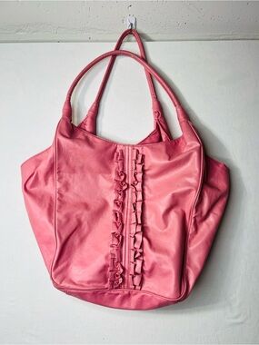 Pink faux leather tote bag with ruffle detailing